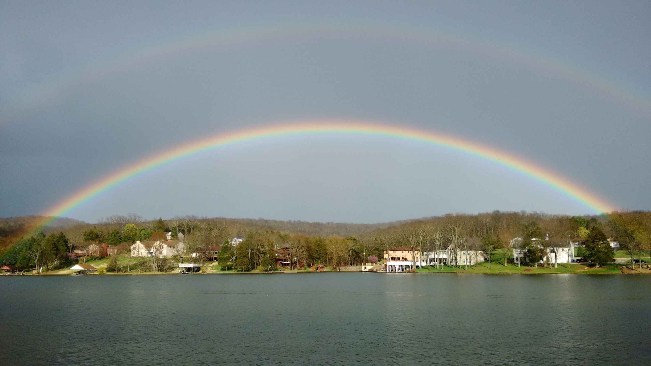 Home rainbow over lake
