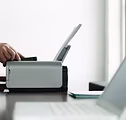 man using computer printer